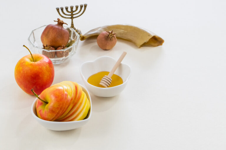 Shot of symbols of the Jewish new year on white background
